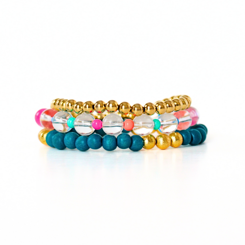 3-piece bracelet stack, designed with gold-filled beads. clear quartz and blue light weight wood beads.