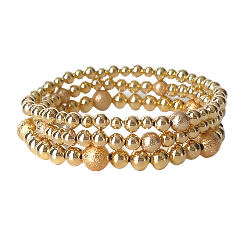 3-Piece 18k gold filled beaded stretch bracelet set. Complete your evening outfit with this stunning all gold beaded sparkly stack. You will for sure turn heads.
