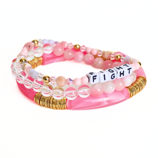 3-piece pink acrylic breast cancer awareness bracelet stack. This bracelet has a dainty letter bead bracelet which can be personalized with any name, initial or inspirational word. Elliot Lane will donate 25% of this bracelet to the Susan G. Komen Foundation.