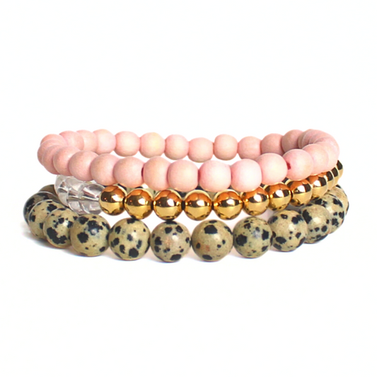 This neutral warm 3-peice set has soft features that go with any outfit. Curated with pink round wooden beads, gold filled beads, clear quartz beads and jasper gemstone beads.