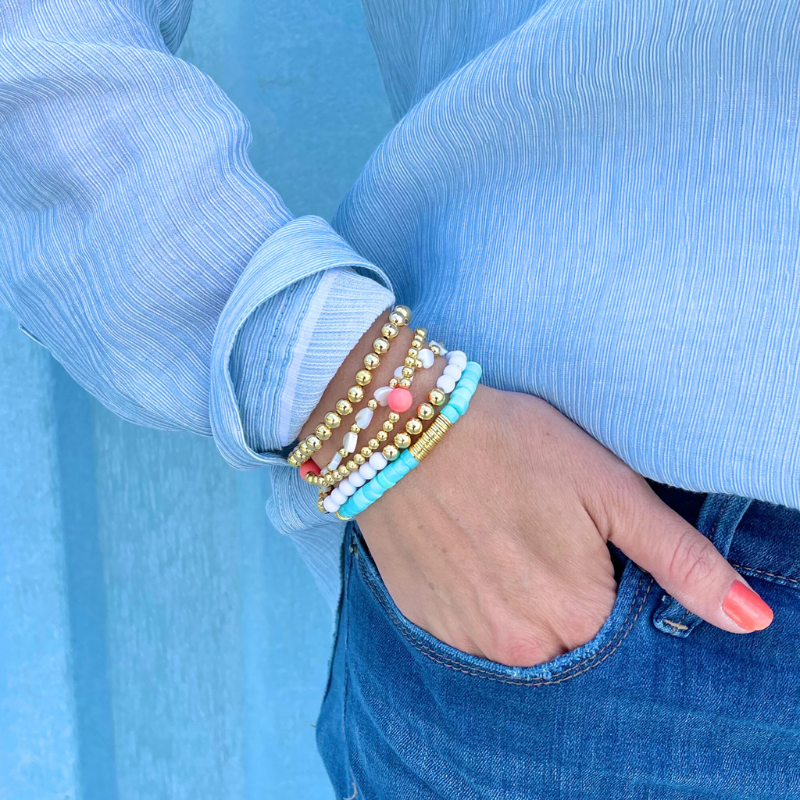 Bracelet Set with blue opal heishi beaded bracelet. Heart charm mother or pearl and gold filled beaded bracelet. Gold beaded stretch bracelets.