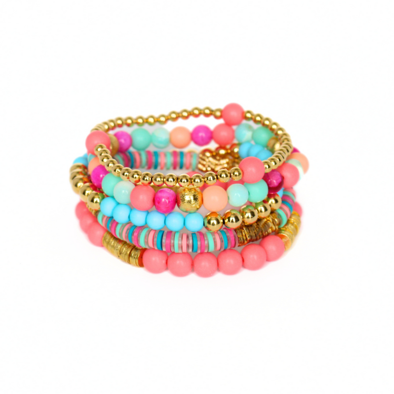 Bracelet stack with 5 beaded stretch bracelets. The Key West bracelet stack is designed with blue and watermelon acrylic beads and polymer clay beads. This bracelet stack is adorned with pink and blue opal gemstones. 18K gold filled beads add long lasting sparkle to this stack.