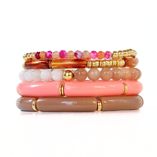 5-piece bracelet stack is designed with coral and brown acrylic bangles. This bracelet stack has a stunning beaded bracelet with chakra, moonstone and sunstone beads. These beads are healing stones and go perfectly with the dainty coral and gold-filled beaded bracelet.