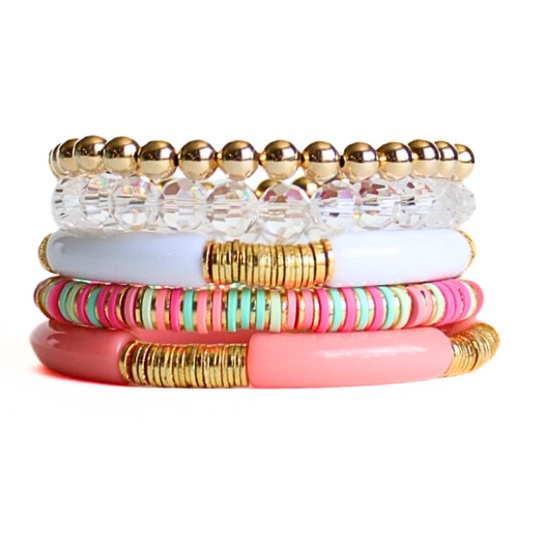 5-piece coral and white acrylic tubed bangle bracelet. Also designed with gold-filled round beads, clear crystal beads and pink and green polymer clay beads.