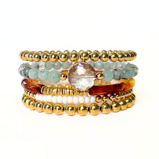 Neutral toned bracelets stack for women.  Featuring gold, acrylic and gemstone beads.