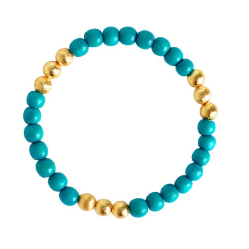 Lightweight turqoise wood stretch bracelet. Accented with brushed gold beads.