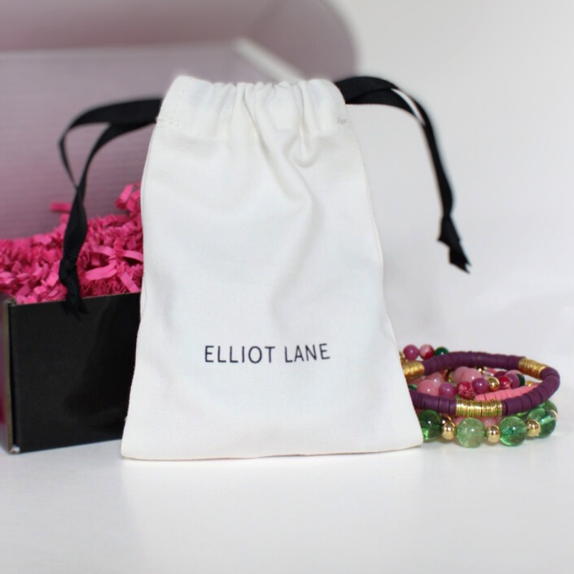 Each bracelet comes with a white soft clothed jewelry bag with black pull strings and monogramed with Elliot Lane. 