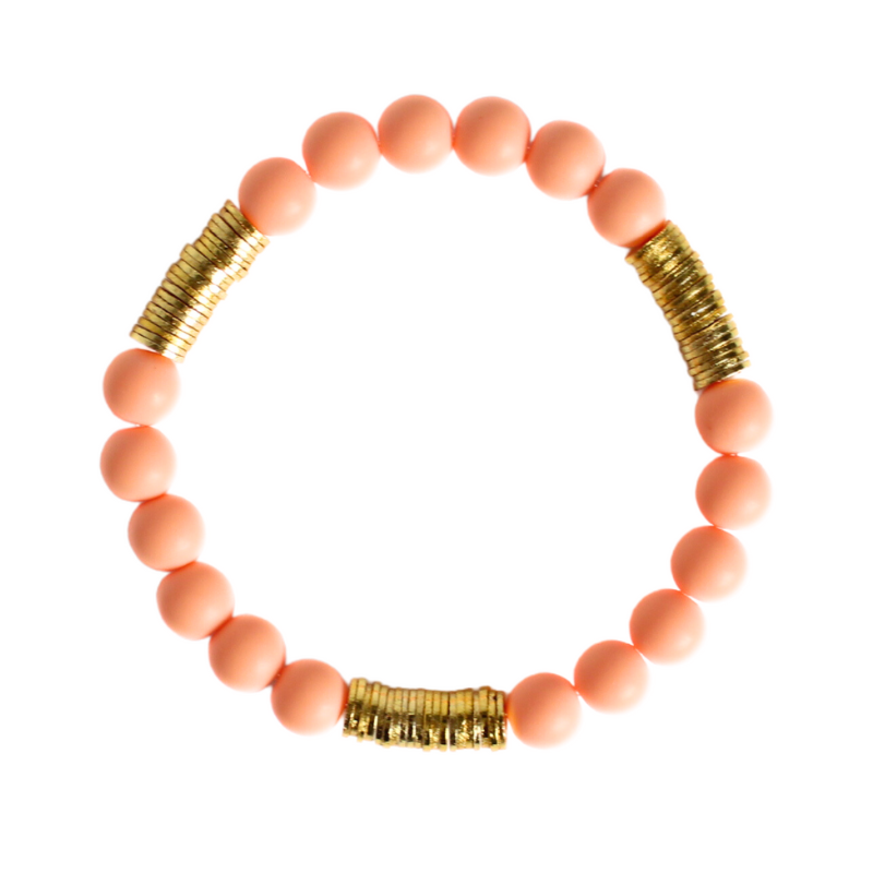 6mm peach acrylic round beaded bracelet with gold plated flats.
