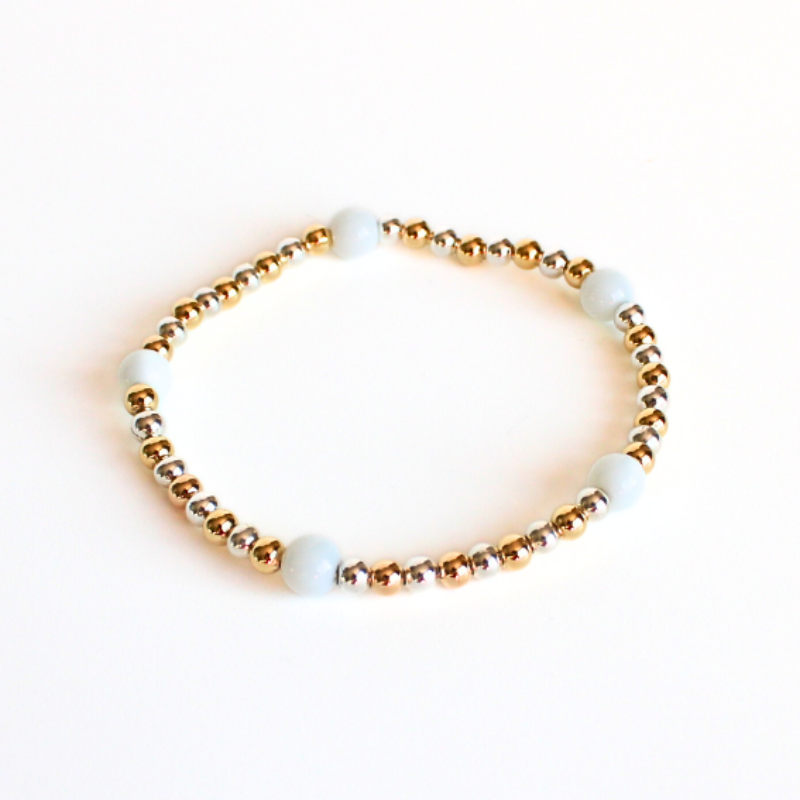 Delicate, two-toned, beaded bracelet features 18k gold filled, silver and white jade gemstone beads