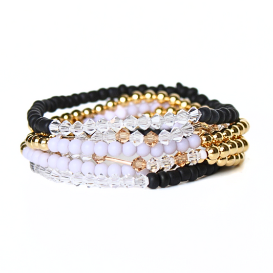 Black and gray 18k gold filled beaded stretch friendship bracelets. This stack comes with 2 sets of 3 bracelets. One for you and one for your bestie. Each bracelet comes with beaded bracelet designed with a Morse code message "bestie" using crystal and gold beads.