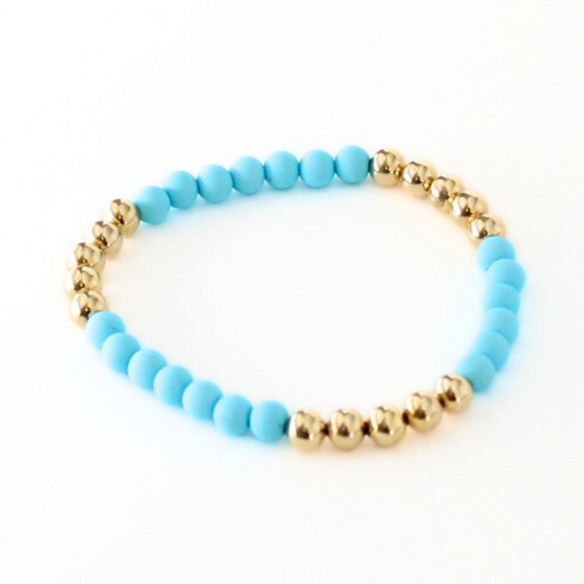 Single blue acrylic matte beaded bracelet. This stretch bracelet had 6mm 18k gold filled round beads.