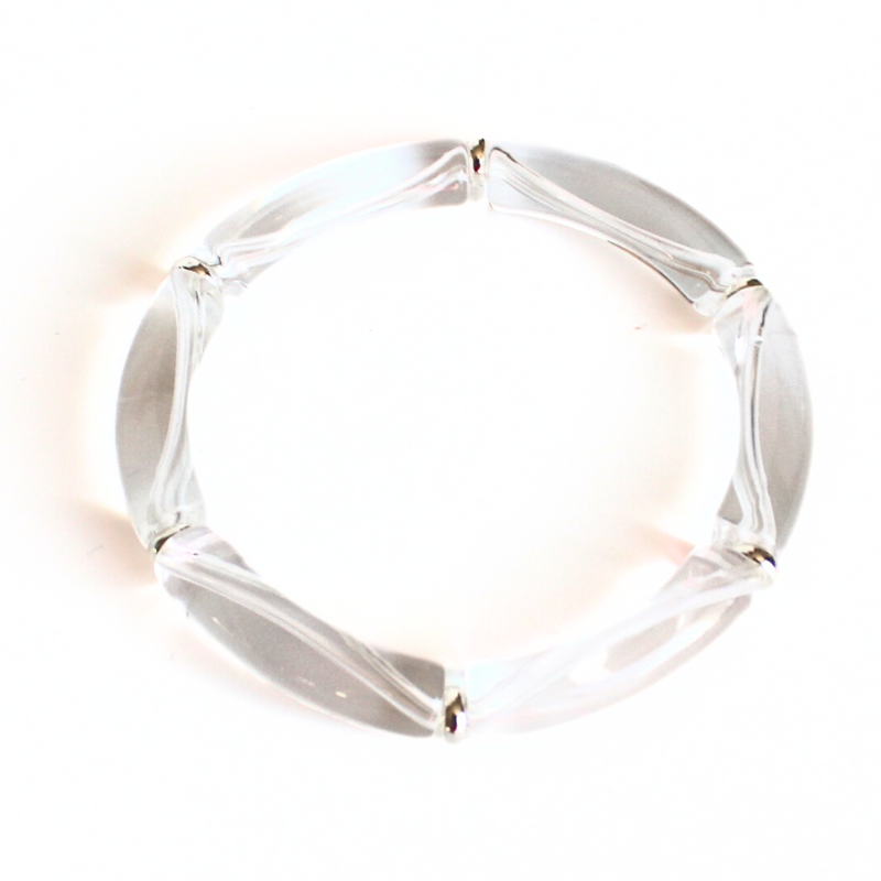 Clear acrylic bangle with silver beads. This lightweight bangle is versatile and will go with any bracelet in your jewelry box.