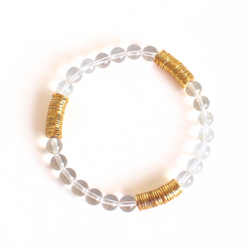 Simple yet sophisticated clear quartz gemstone beaded bracelet will add a little extra sparkle to your stack. Curated with gold plated flats this bracelet is simple yet elegant.