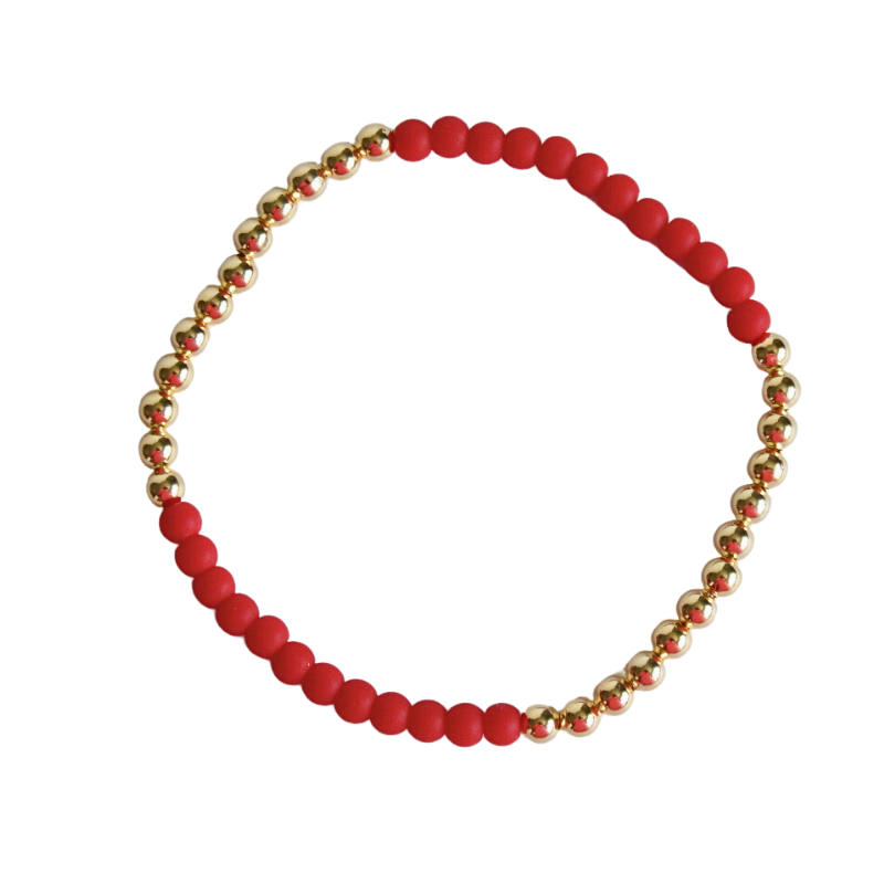 This dainty red beaded stretch bracelet is designed with 18k gold filled beads. Although light and simple this bracelet looks stunning alone or with any bracelet stack.