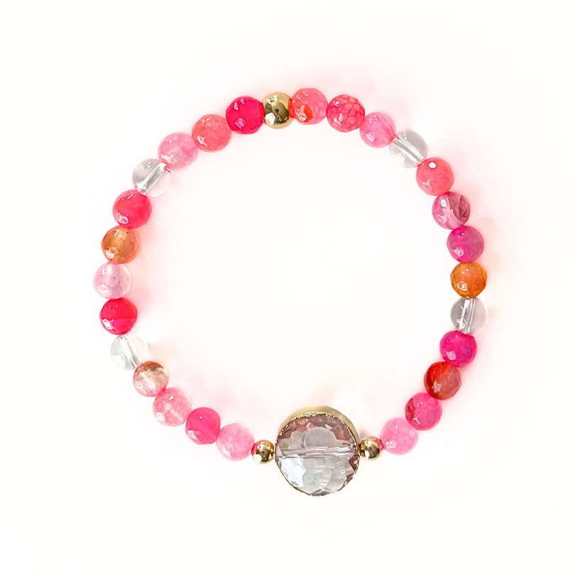 Pink agate gemstone bracelet with clear quartz beads and a crystal round charm.
