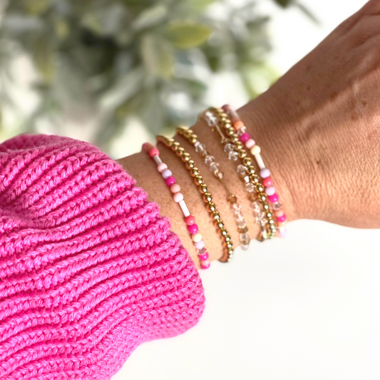 Matching best friend bracelets; one for you and one for you best friend. These beaded bracelets are not our typical childhood best friend bracelets. These best friend bracelets are curated with 18k gold filled round beads, pink glass beads, and crystal beads. Each bracelet is uniquely designed with a "bestie" Morse code message using crystal beads.