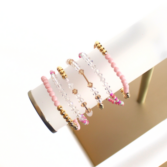 Matching best friend bracelets; one for you and one for you best friend. These beaded bracelets are not our typical childhood best friend bracelets. These best friend bracelets are curated with 18k gold filled round beads, pink rainboe glass beads, and crystal beads. Each bracelet is uniquely designed with a "bestie" Morse code message using crystal beads.