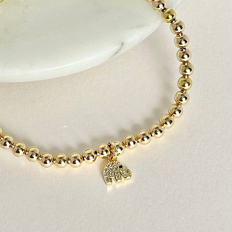 Tiny gold elephant charm bracelet